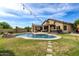 Inviting backyard oasis with a sparkling pool and patio at 20811 E Excelsior Ave, Queen Creek, AZ 85142