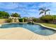 Freeform pool with a waterfall feature and string lights at 20811 E Excelsior Ave, Queen Creek, AZ 85142