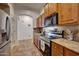 Kitchen with stainless steel appliances and granite countertops at 21930 W Rancho Del Oro Dr, Wittmann, AZ 85361