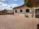 Backyard featuring desert landscaping for low maintenance, complemented by a patio for outdoor enjoyment at 2233 N Middlecoff Dr, Mesa, AZ 85215