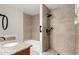 Nicely renovated bathroom with stylish tile, granite countertop, and modern fixtures at 2233 N Middlecoff Dr, Mesa, AZ 85215