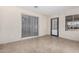 Bright room with tile floors, a sliding door, and a side door, ideal for an office or den at 2233 N Middlecoff Dr, Mesa, AZ 85215