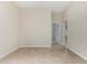 Versatile bonus room with tile flooring and a convenient hallway leading to other rooms at 2233 N Middlecoff Dr, Mesa, AZ 85215