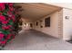 Covered carport showcasing the home's entrance and desert landscaping at 2233 N Middlecoff Dr, Mesa, AZ 85215