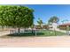 Fenced community area with picnic tables, a gazebo, manicured landscaping, and inviting seating at 2233 N Middlecoff Dr, Mesa, AZ 85215