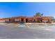 Well-maintained community center featuring ample parking and desert landscaping, a hub for neighborhood activities at 2233 N Middlecoff Dr, Mesa, AZ 85215