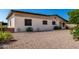 Gravel backyard, showing home's back exterior and landscaping at 2233 N Middlecoff Dr, Mesa, AZ 85215