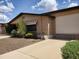 Property featuring low-maintenance landscaping, brick accents, and a well-maintained exterior at 2233 N Middlecoff Dr, Mesa, AZ 85215