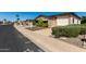 Charming single-story home with a well-maintained front yard and covered parking at 2233 N Middlecoff Dr, Mesa, AZ 85215