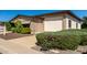 Charming single-story home with a well-maintained front yard and covered parking at 2233 N Middlecoff Dr, Mesa, AZ 85215