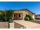 Charming single-story home with a well-maintained front yard and covered parking at 2233 N Middlecoff Dr, Mesa, AZ 85215
