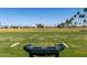 Practice tee on the golf course features a verdant green landscape with the neighborhood in the distance at 2233 N Middlecoff Dr, Mesa, AZ 85215