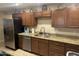 Kitchen with granite countertops, stainless steel appliances, and ample cabinetry at 2233 N Middlecoff Dr, Mesa, AZ 85215