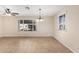Bright living room featuring tile flooring, a ceiling fan, and a large window at 2233 N Middlecoff Dr, Mesa, AZ 85215