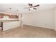 Open-concept kitchen and living room featuring tile flooring, pendant lighting, and ceiling fan at 2233 N Middlecoff Dr, Mesa, AZ 85215