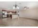 Open concept living area with stainless steel appliances and granite countertops at 2233 N Middlecoff Dr, Mesa, AZ 85215