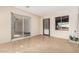 The sunroom offers light-filled space with tile flooring, large sliding glass doors, and bright windows at 2233 N Middlecoff Dr, Mesa, AZ 85215