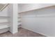 Spacious walk-in closet with built-in shelving and ample storage space at 2233 N Middlecoff Dr, Mesa, AZ 85215