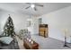 Living room with a Christmas tree, couch, and armchair at 22525 W Antelope Trl, Buckeye, AZ 85326