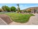Landscaped backyard with a pool, spa, and sports court at 23807 N 64Th Ave, Glendale, AZ 85310