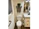 Clean bathroom with white vanity, toilet and a towel rack at 23807 N 64Th Ave, Glendale, AZ 85310