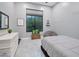 Bright bedroom with a comfortable bed and a large window at 23807 N 64Th Ave, Glendale, AZ 85310