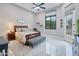 Bright bedroom with a large bed and access to the backyard at 23807 N 64Th Ave, Glendale, AZ 85310