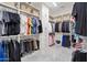 Large walk-in closet with ample shelving and hanging space for clothes at 23807 N 64Th Ave, Glendale, AZ 85310