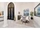 Formal dining room with a large table and chandelier at 23807 N 64Th Ave, Glendale, AZ 85310