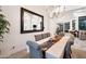 Bright dining room, large mirror, and elegant chandelier at 23807 N 64Th Ave, Glendale, AZ 85310