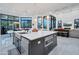 Large kitchen island with white countertops and modern appliances at 23807 N 64Th Ave, Glendale, AZ 85310