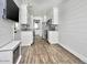 Modern kitchen with white cabinets and wood flooring at 23807 N 64Th Ave, Glendale, AZ 85310