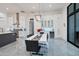 Elegant kitchen with white cabinets, breakfast bar, and dining area at 23807 N 64Th Ave, Glendale, AZ 85310