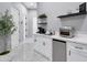 Small kitchenette with appliances and shelving at 23807 N 64Th Ave, Glendale, AZ 85310