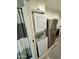 Compact laundry area with stacked washer and dryer at 23807 N 64Th Ave, Glendale, AZ 85310