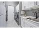 Bright laundry room with modern appliances and ample storage at 23807 N 64Th Ave, Glendale, AZ 85310