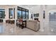 Open living space includes a comfortable seating area, fireplace, and large windows with mountain views at 23807 N 64Th Ave, Glendale, AZ 85310