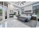 Luxurious main bedroom features a king-size bed, fireplace, and private access to backyard at 23807 N 64Th Ave, Glendale, AZ 85310