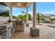 Outdoor kitchen with a built-in grill and plenty of counter space at 23807 N 64Th Ave, Glendale, AZ 85310
