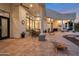 Covered patio with outdoor dining and entertainment area at 23807 N 64Th Ave, Glendale, AZ 85310