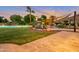 Inviting pool and spa area with shade structures and landscaping at 23807 N 64Th Ave, Glendale, AZ 85310