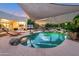 Stunning pool with shade structures and beautiful landscaping at 23807 N 64Th Ave, Glendale, AZ 85310