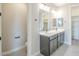 Bathroom boasting double sinks, a toilet, and closet at 24177 W Hilton Ave, Buckeye, AZ 85326