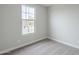 Carpeted bedroom featuring a large window at 24177 W Hilton Ave, Buckeye, AZ 85326