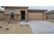 Charming single-Gathering home featuring stone accents, a two-car garage, and desert landscaping at 24177 W Hilton Ave, Buckeye, AZ 85326