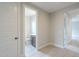 Hallway view showcasing the bathroom and bedrooms at 24177 W Hilton Ave, Buckeye, AZ 85326