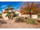 Front view of a house with palm trees and drought-tolerant landscaping at 26402 S Howard Dr, Sun Lakes, AZ 85248