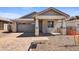 One-story home with gray exterior, stone accents, and a two-car garage at 31277 N 130Th Ave, Peoria, AZ 85383