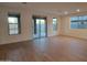 Spacious living room with tile floors and sliding glass doors at 31363 N 130Th Ave, Peoria, AZ 85383