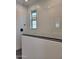 Stylish walk-in shower featuring custom wall tile, black trim and fixtures, and a window at 31363 N 130Th Ave, Peoria, AZ 85383